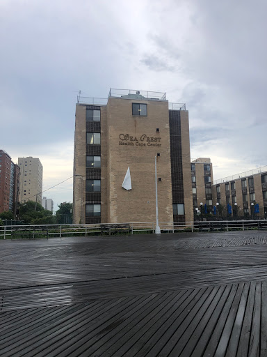 A modern building stands against a cloudy sky, showcasing urban architecture.