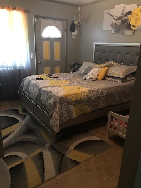 A bedroom featuring an impressive optical illusion with a 3D floor design.