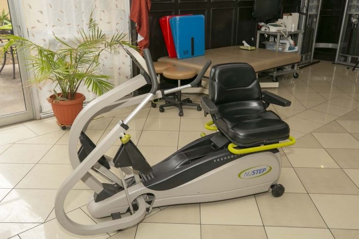 A recumbent exercise bike setup in a room, ready for indoor fitness use.