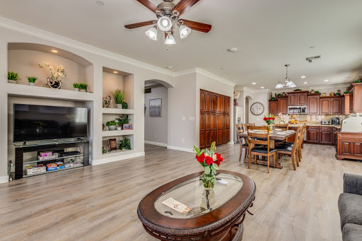 A beautifully designed open-concept living and dining area featuring modern decor and natural light.