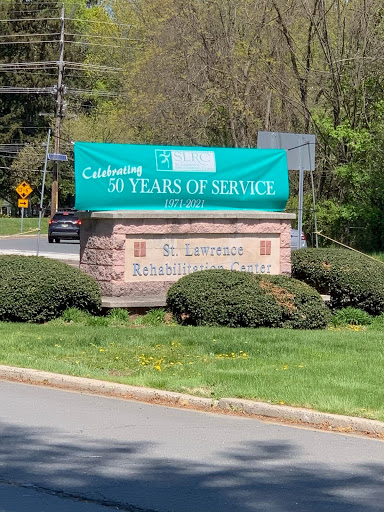 A banner celebrating years of service displayed at a roadside.