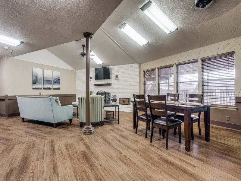 Spacious living and dining area with modern furniture and ample natural light.