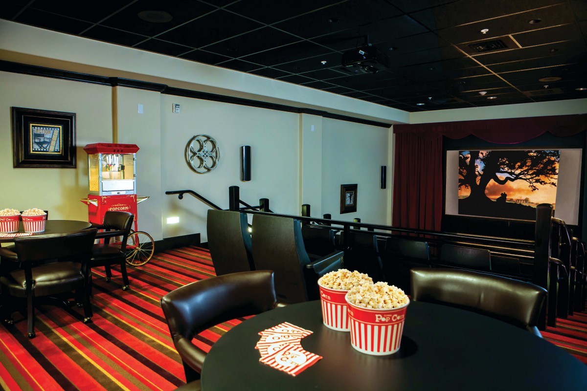 Cozy home theater setup with popcorn and cinema-style seating.
