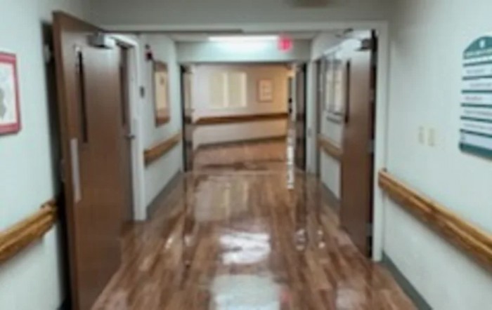 A clean and well-lit hallway in a hospital setting.