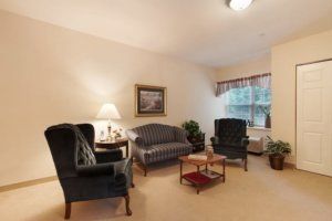 A cozy living room with classic furniture and soft lighting.
