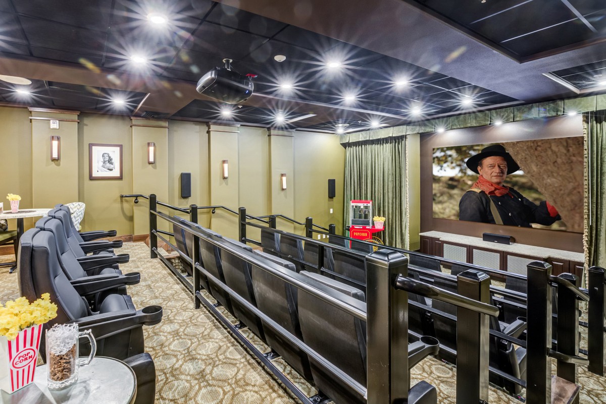A stylish home theater with comfortable seating and ambient lighting.