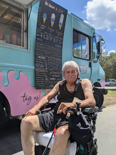 Enjoying a sunny day by the ice cream truck.