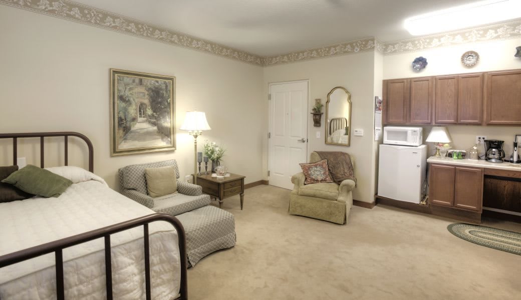 A cozy living room with comfortable seating and warm lighting.
