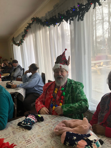 A joyful holiday gathering with cheerful decorations and festive attire.