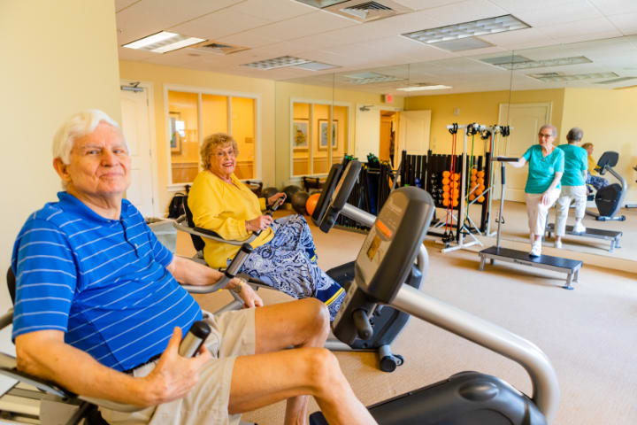 Seniors enjoying a workout session at the gym.