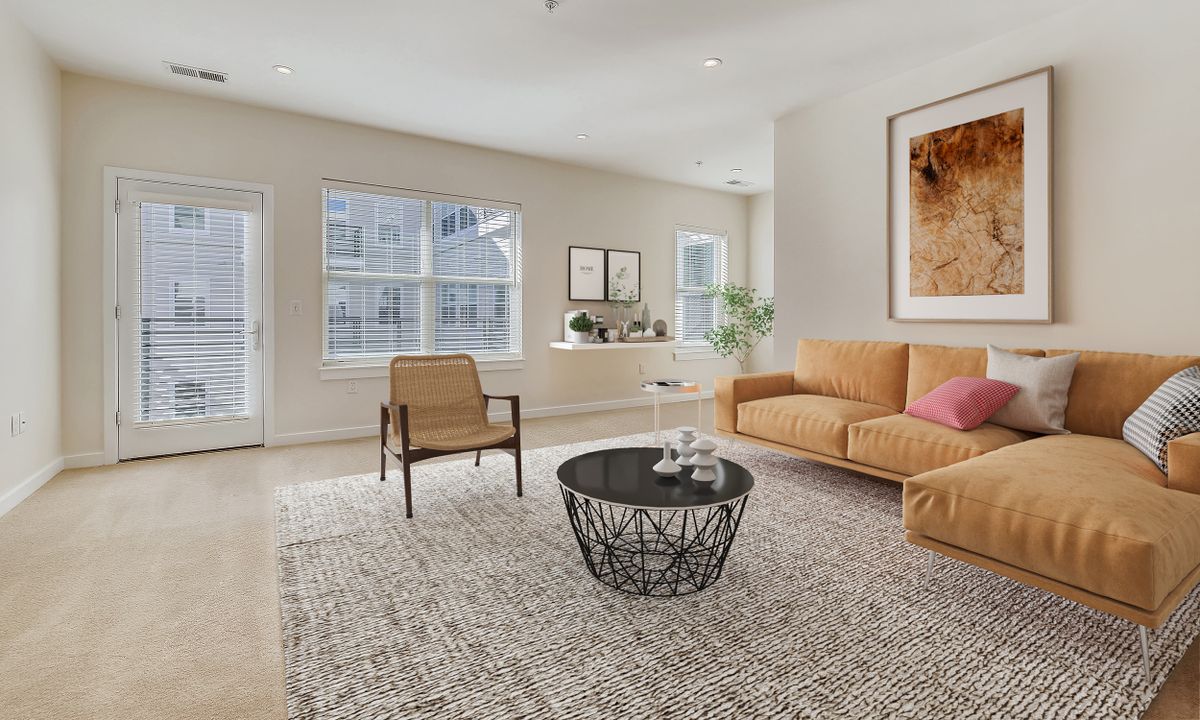A modern living room with a cozy sofa, stylish coffee table, and elegant decor.