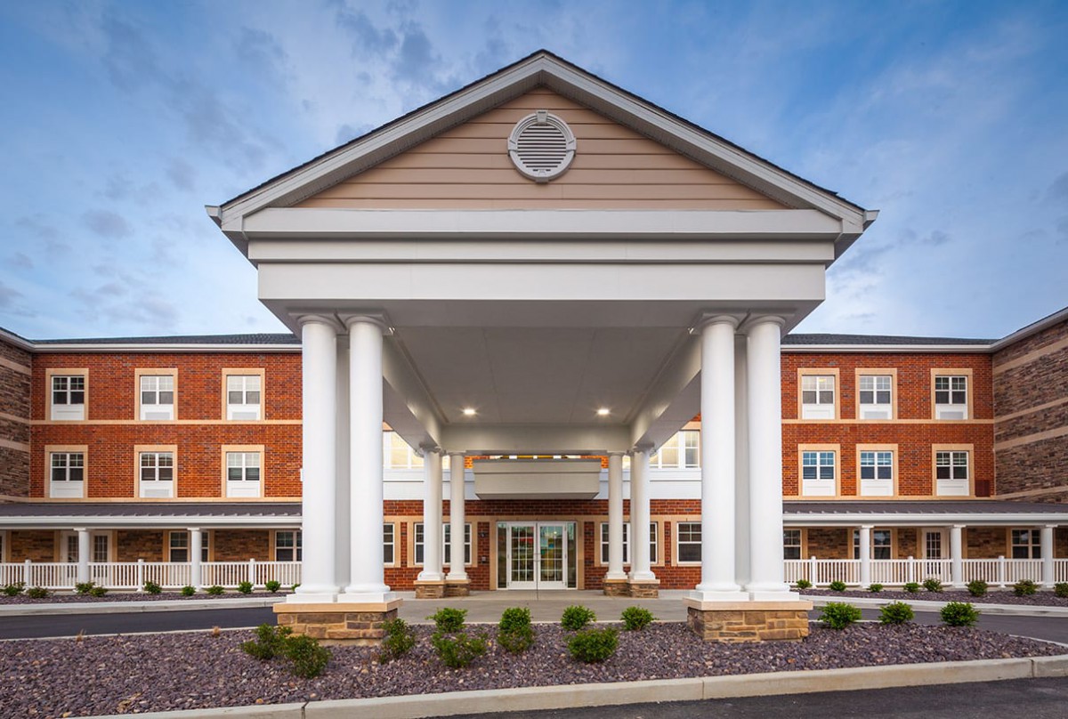 A grand building entrance with large columns and symmetrical architecture.