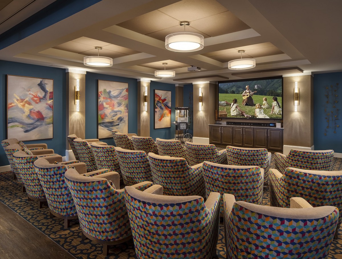 A luxurious home theater with comfortable seating and a large screen, perfect for movie nights.