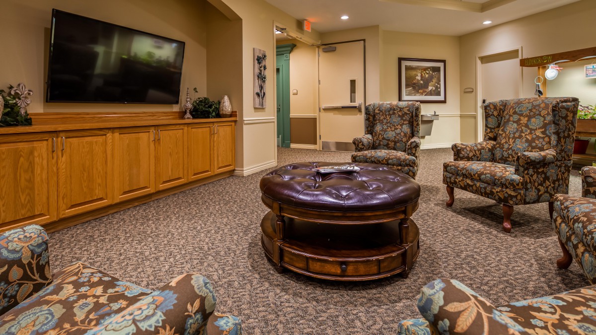 A cozy living room with comfortable seating and a television.