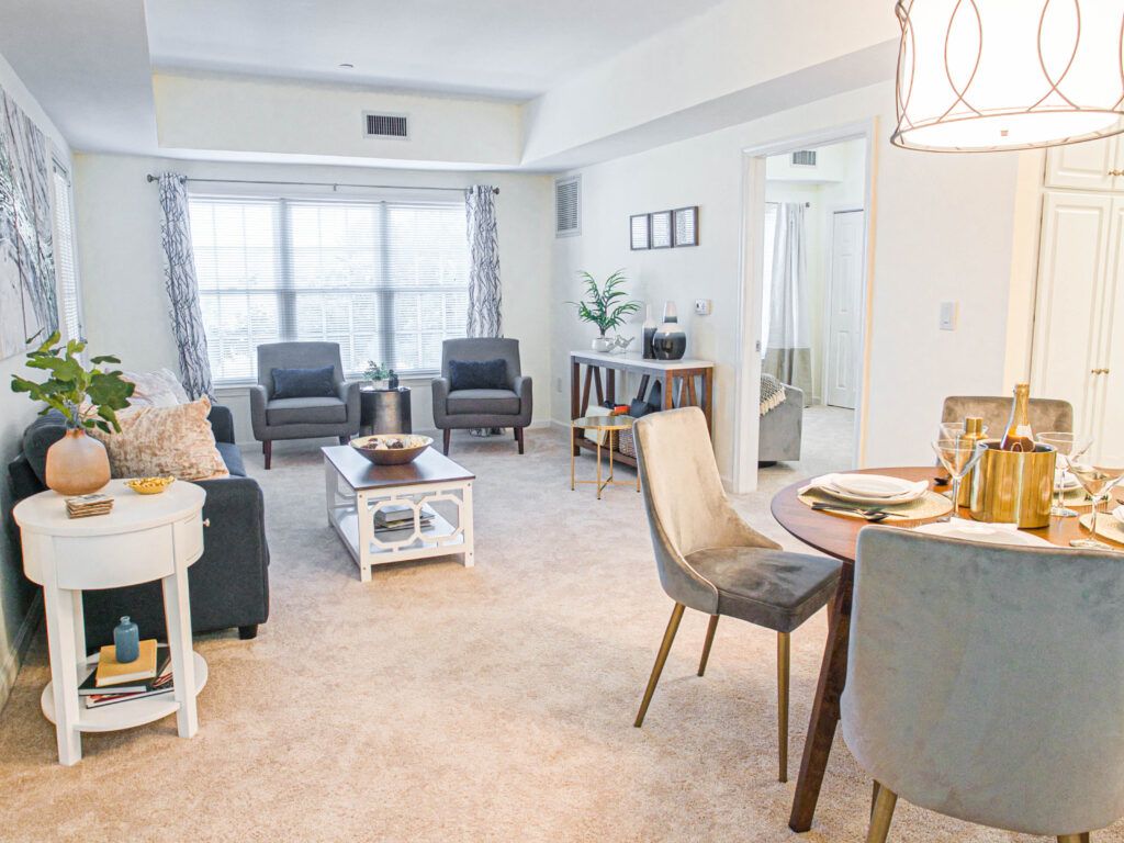 A well-furnished living and dining area in a modern apartment.