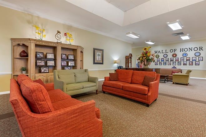 A cozy living room with colorful sofas arranged for comfortable seating.