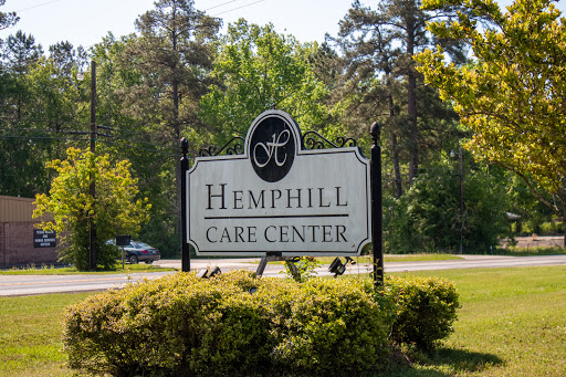 Entrance to Hemphill Care Center surrounded by greenery.