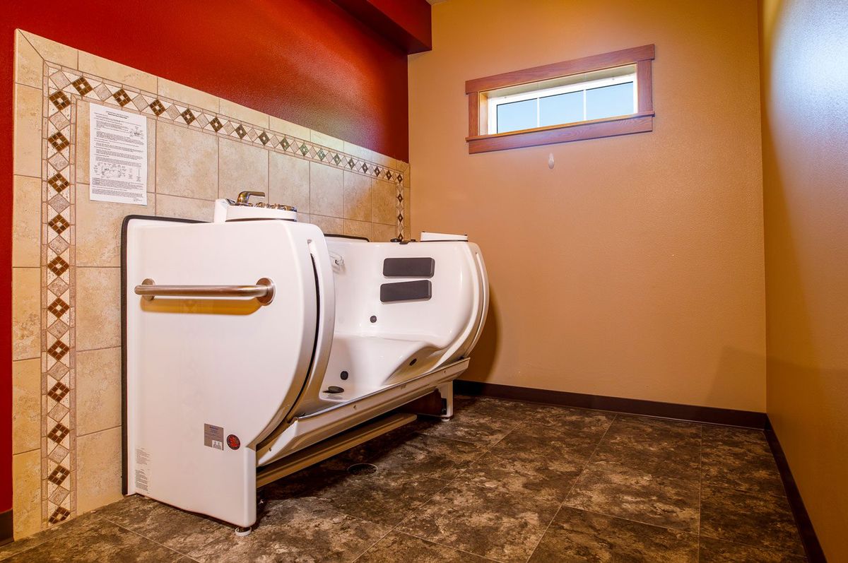 A bathroom with a walk-in bathtub designed for accessibility.