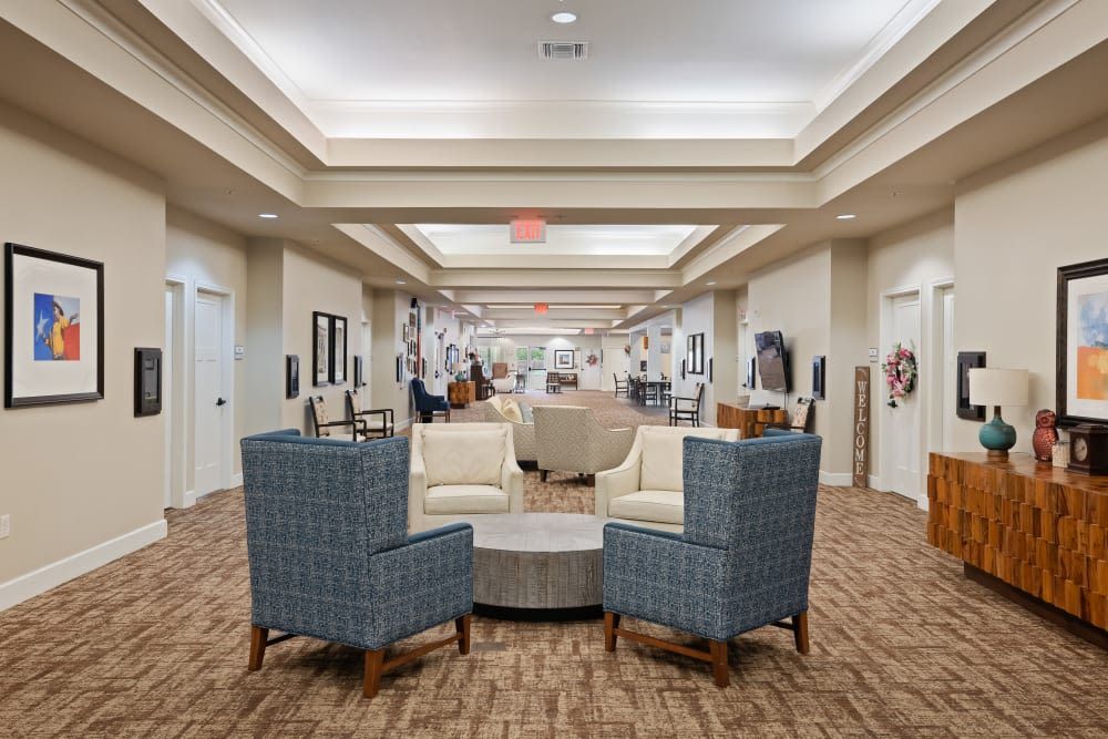 A spacious lobby with comfortable seating and bright lighting.