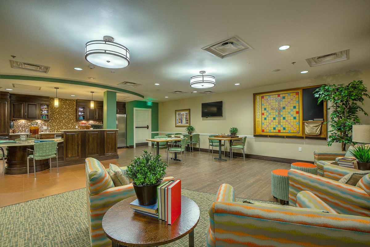 A modern lounge with comfortable seating and ambient lighting.