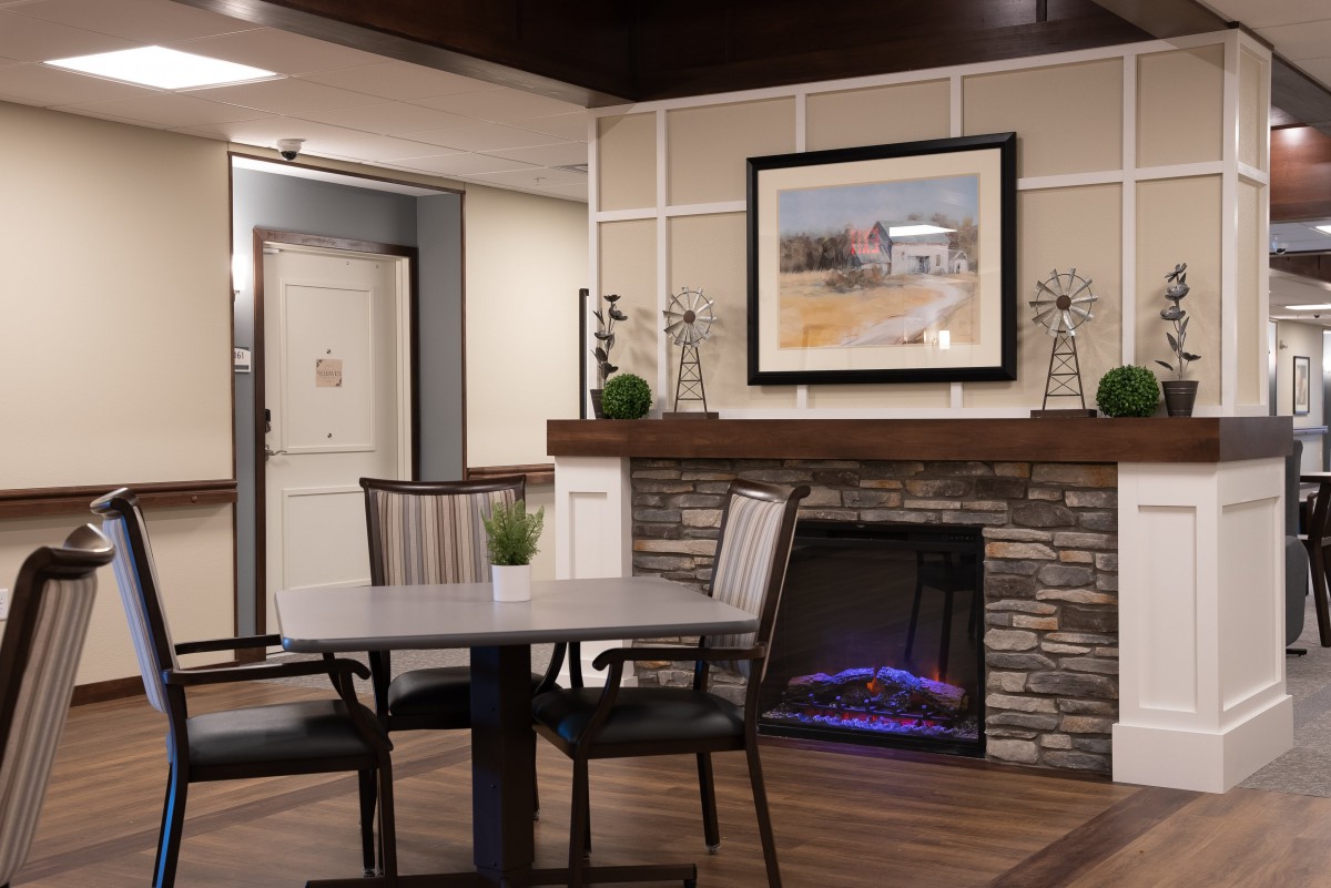 A modern interior with a stone fireplace and elegant decor.