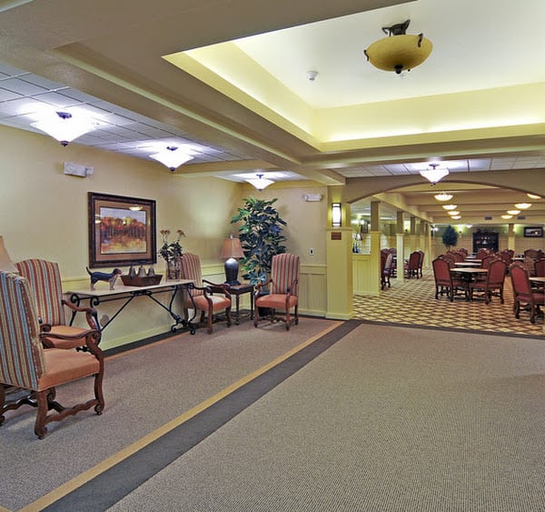 A spacious and elegantly decorated lobby area with comfortable seating and warm lighting.