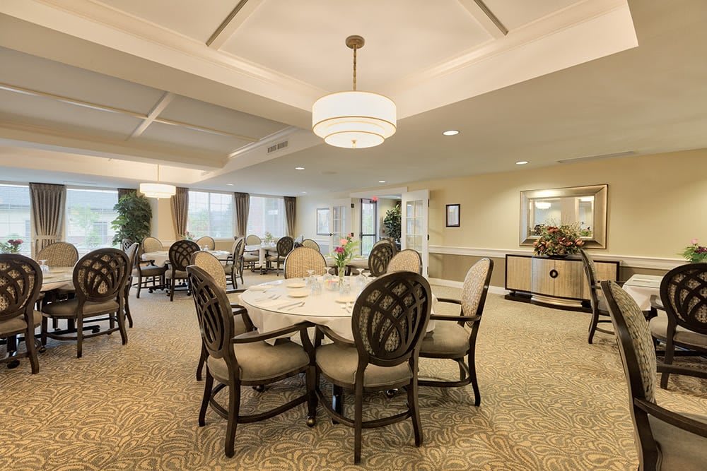 Elegant dining area with round tables and comfortable seating.