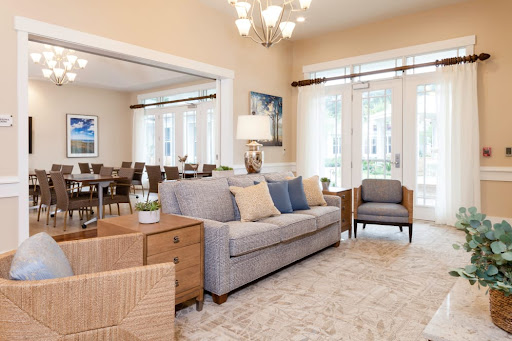 A cozy and modern living room with stylish furniture and ample natural light.