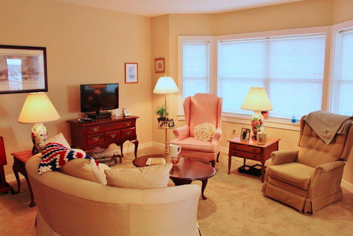 A cozy living room featuring comfortable seating, soft lighting, and a welcoming atmosphere.