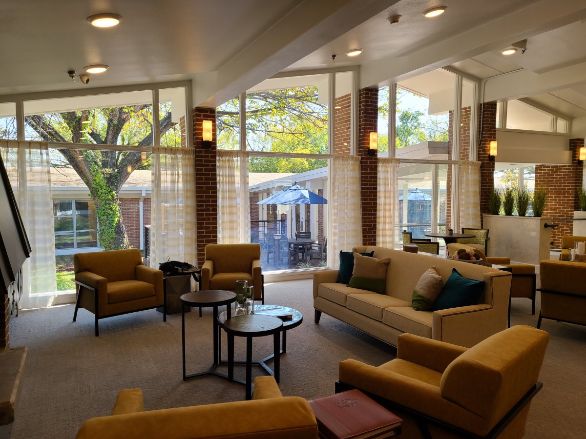 A modern lobby with comfortable seating and large windows allowing ample natural light.
