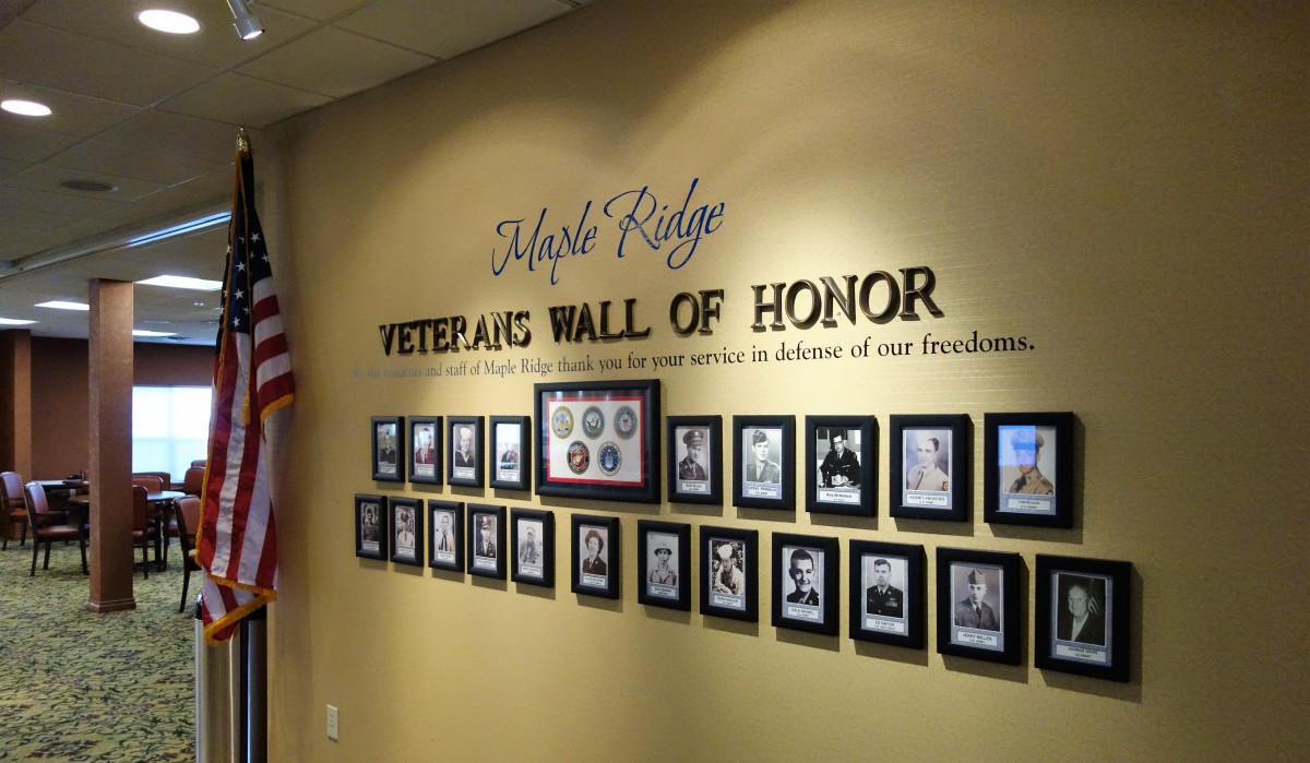 Maple Ridge Veterans Wall of Honor displaying photographs and memorabilia in tribute to those who served.