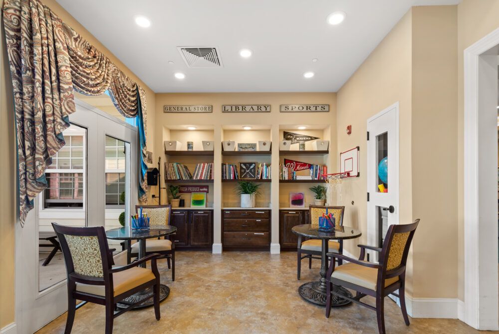 A cozy waiting area with seating, bookshelves, and decorative elements.