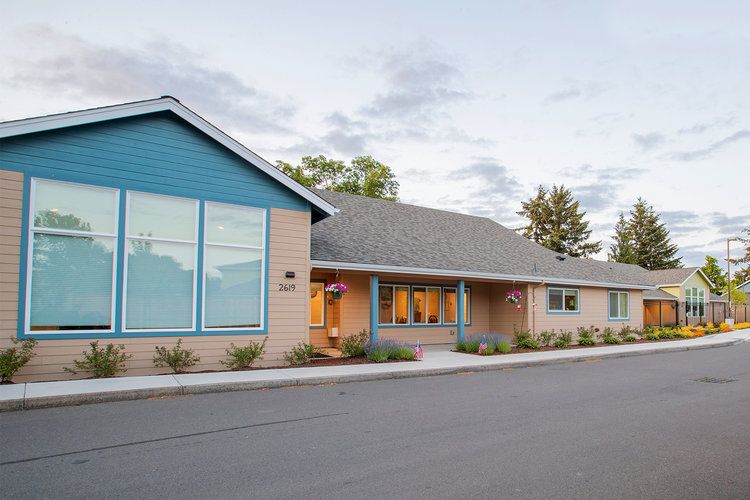 A modern residential-style building with a well-maintained exterior and landscaping.