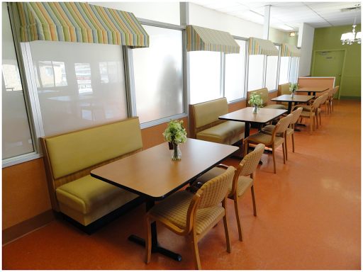 A cozy dining area with booth seating and tables, designed for casual meals.
