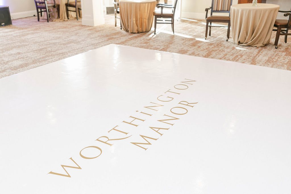 The lobby of Worthington Manor with its elegant flooring and seating area.