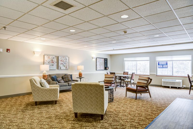 A cozy living room with comfortable seating and soft lighting.