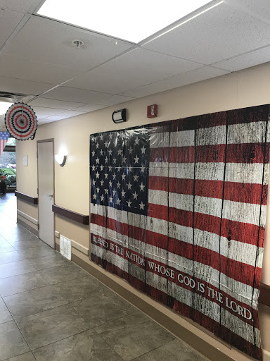 A creatively designed American flag mural embellishes the hallway, adding a touch of patriotism to the space.