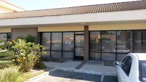 An empty storefront in a commercial plaza.