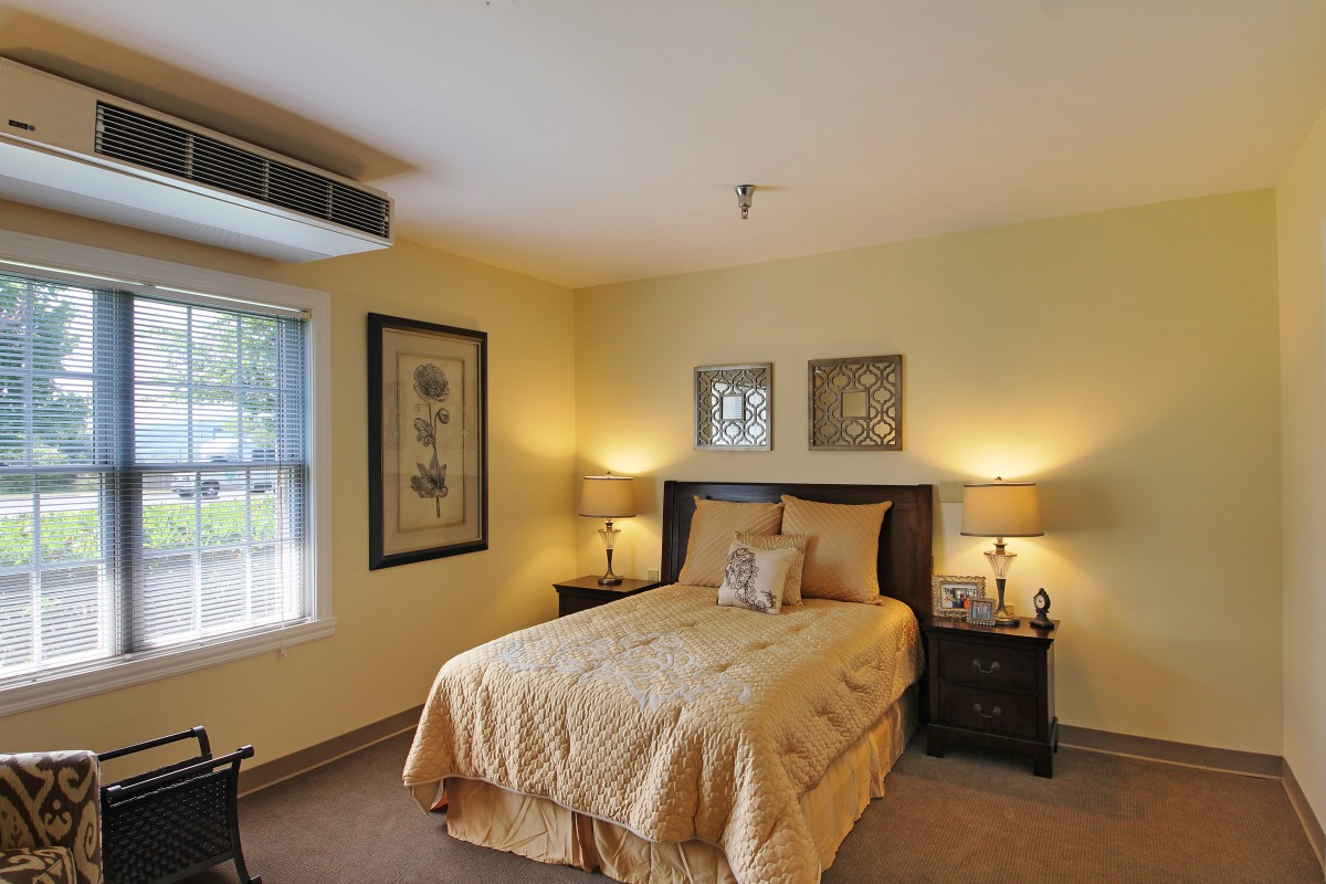 A cozy bedroom with warm lighting and stylish decor.