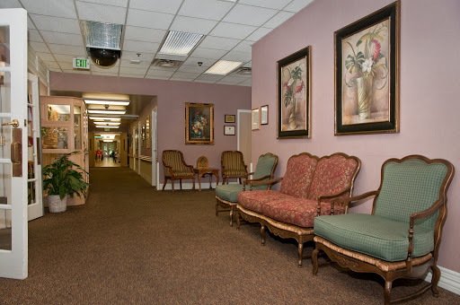 A cozy waiting room featuring vintage furniture and decorative artwork.