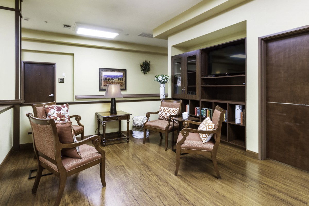 A cozy waiting room with comfortable chairs and elegant decor.