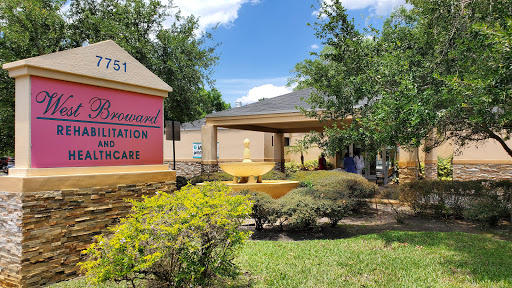 A view of a healthcare facility with well-maintained landscaping and clear signage.