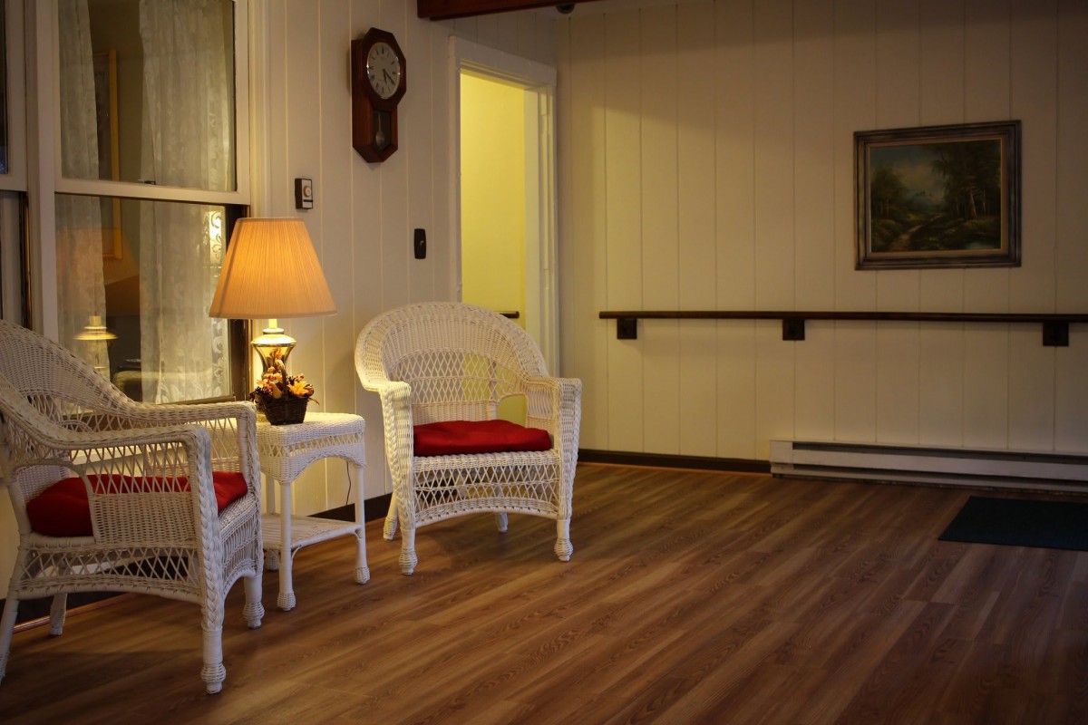 A cozy living room with wicker furniture and warm lighting.