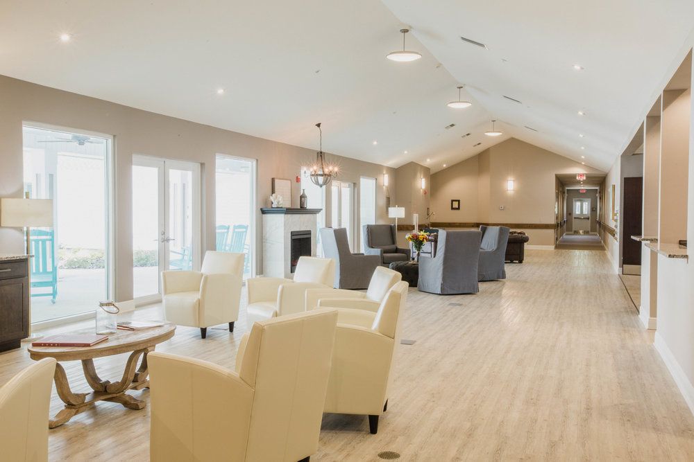 A spacious and modern lounge with comfortable seating.