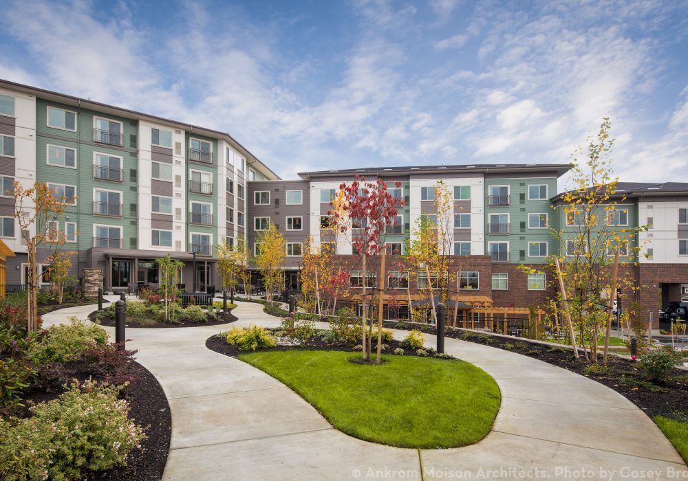 A modern apartment complex with landscaped outdoor areas.