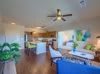 A spacious open-concept living area featuring a modern kitchen and dining space.