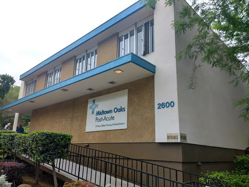 A healthcare facility promoting health access, featuring a modern architectural design.