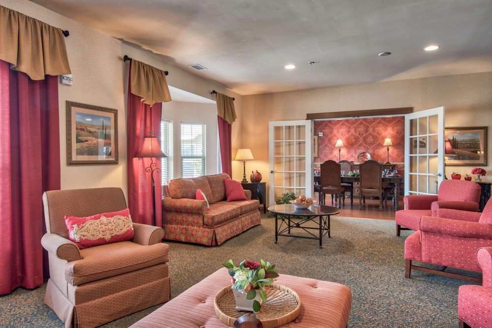 A cozy living room with comfortable seating and warm lighting.