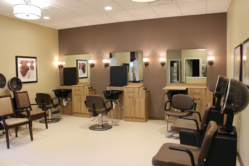 A well-organized salon space with styling chairs and mirrors.