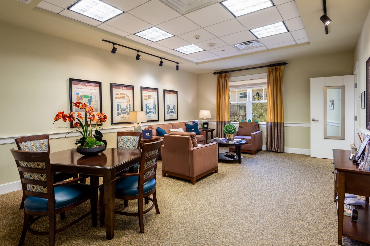 A cozy living room with comfortable seating and decorative elements.